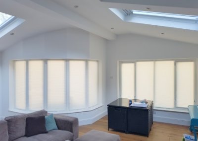 Signature pleated blinds are a wonderful way to dress a rounded bay window