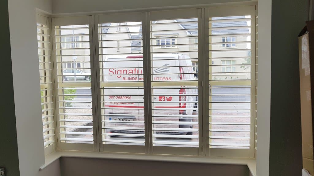 Plantation shutters fitted onto a bay window in County Kildare
