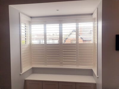 2 Large Bay Windows fitted with Weston and Titan Shutters.