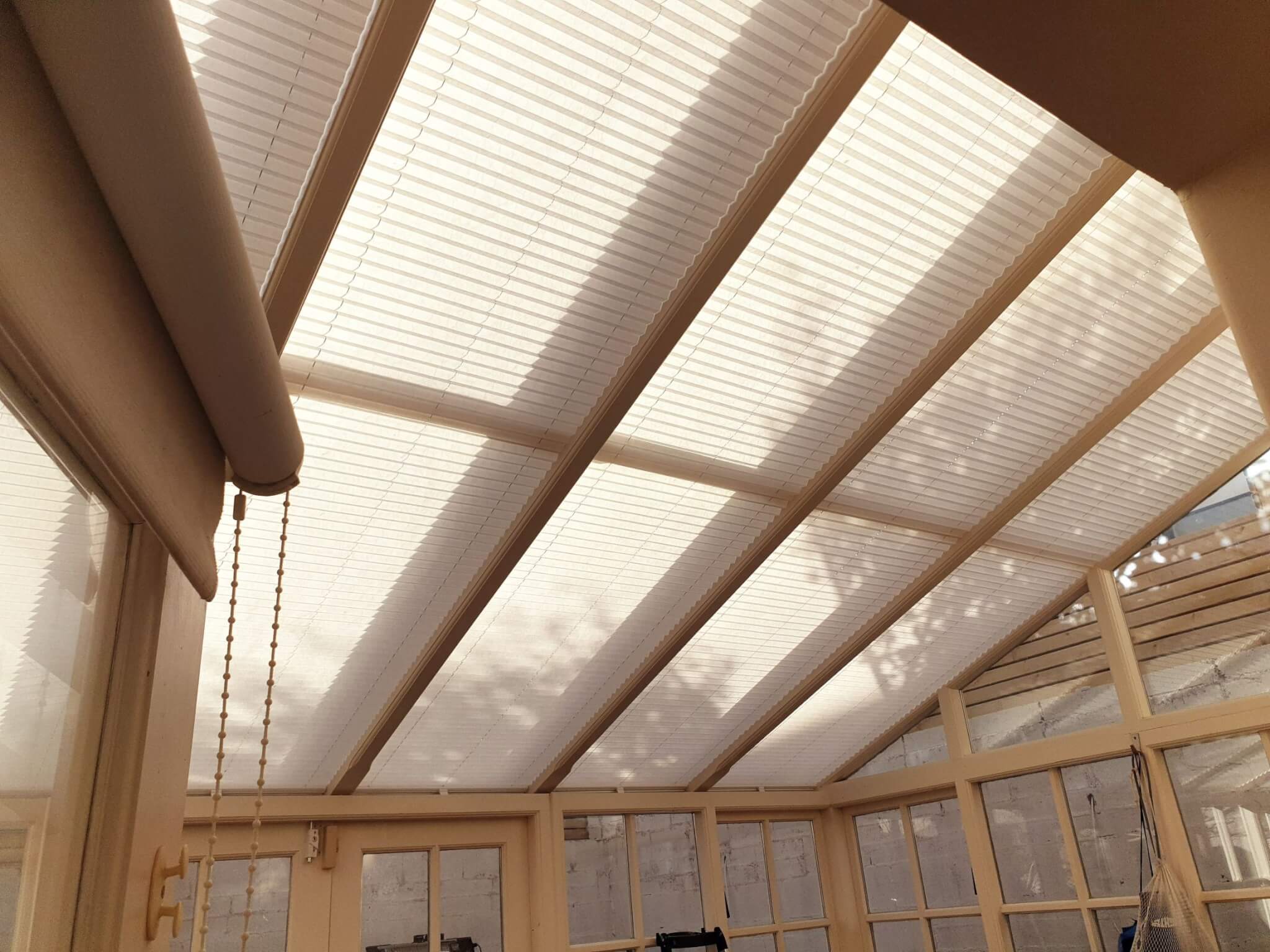 Motorised Roof Pleated Blinds fitted in a Lean To Conservatory