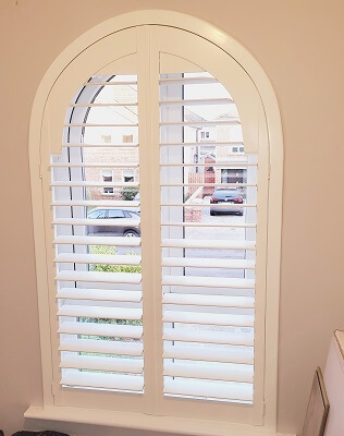 Arched shutter installed in Clonsilla. Shaped Shutters in Dublin