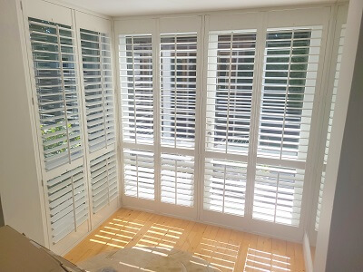 L Shaped bay window fitted with shutters in Dundrum, Dublin.