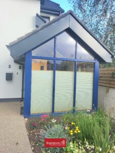 Outside view of Pleated Blinds in a Sunroom on Doors and Windows