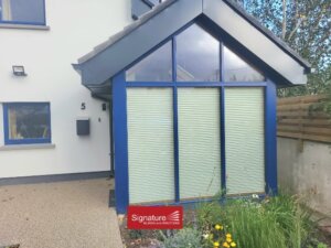 Outside view of Pleated Blinds in a Sunroom on Windows