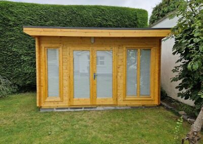 Pleated Blinds Outside Log Cabin