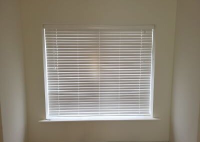 Closed White Venetian Blinds